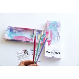 Da Vinci Pretty Art Brush Set, open packaging showing dot card, brush soap, and three brushes being held