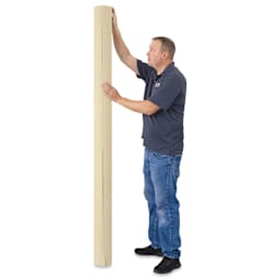 Blick Unprimed Cotton Canvas - Medium Weight, Medium-Smooth Texture, 84" x 25 yds, man standing next to roll