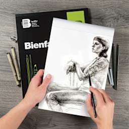 Bienfang Drawing Paper Pad, artist drawing on a sheet of paper with pencils (not included)