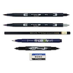 Tombow Lettering Basics Set, pens and markers with caps off, laid outside of the packaging