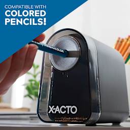 Mighty Mite Electric Pencil Sharpener with Pencil Saver - Hand holding pencil in sharpener