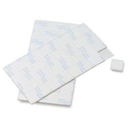 Removable Mounting Tabs - 2 sheets of 1/2 " tabs shown with 1 tab removed