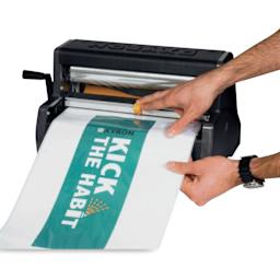 Xyron Pro XM1255 Cold Laminator - 12" in the process of laminating paper