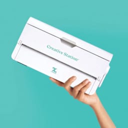 Xyron 900 Creative Station Laminator being held