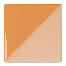 Speedball Ceramic Underglaze - Peach, Opaque, fired on white clay bisque tiles, half covered in Speedball Clear Glaze, fired to cone 05
