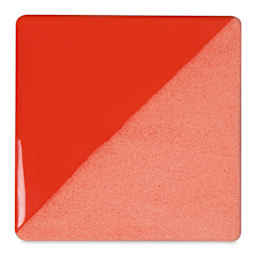 Speedball Ceramic Underglaze - Flame Red, Opaque, fired on white clay bisque tiles, half covered in Speedball Clear Glaze, fired to cone 05