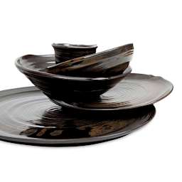 Stack of finished dishware made with Sio-2 PRNI Black Stoneware Clay