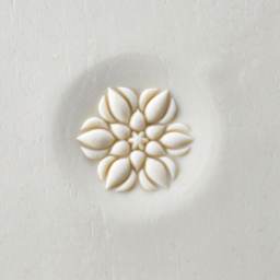 MKM Pottery Tools Curve Top Stamp - Lotus Buds, stamped into clay