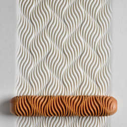 MKM Pottery Tools Big Hand Roller - Wave Flow applied to clay