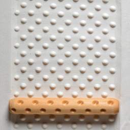 MKM Pottery Tools Hand Roller - Dots applied to clay