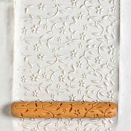 MKM Pottery Tools Hand Roller - Laura's Flora applied to clay