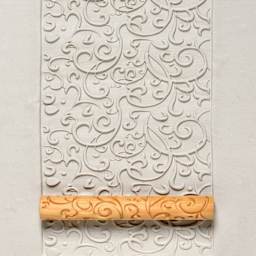 MKM Pottery Tools Twig Hand Roller - Curlicue applied to clay