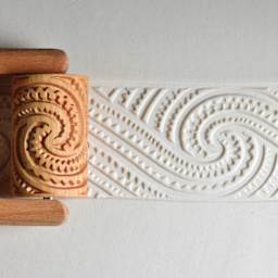 MKM Pottery Tools Large Handle Roller - Maori Spirals 2 applied to clay