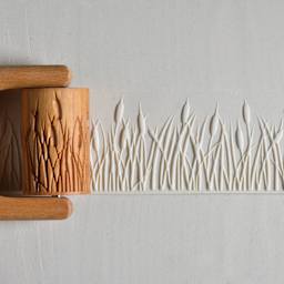 MKM Pottery Tools Large Handle Roller - Cattails applied to clay