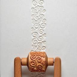 MKM Pottery Tools Medium Handle Roller - Tri Spirals applied to clay