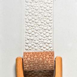 MKM Pottery Tools Large Handle Roller - Cobbles applied to clay