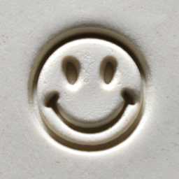 MKM Pottery Tools Medium Round Stamp - SCM-201, Smiley Face applied to clay