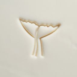 MKM Pottery Tools Large Round Stamp - SCL-170, Whale Tail applied to clay