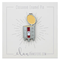 Elan Transfers Enamel Pin - Red Kiln, pinned to front of packaging