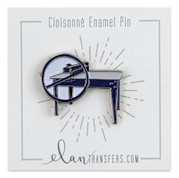 Elan Transfers Enamel Pin - Slab Roller Blue pinned to front of packaging