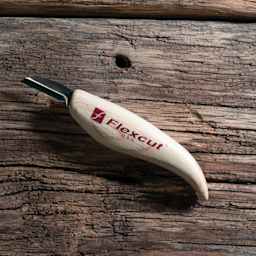 Flexcut Cutting Knife laying on wooden table