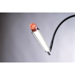 Daylight Techne 2 Artist & Drafting Lamp - Black and Orange, close-up of light