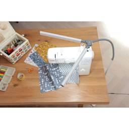 Daylight DuoPro Floor Lamp - top view of lamp lit over sewing table