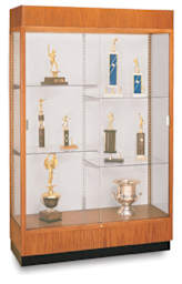 Waddell Carmel Oak Frame Floor Case - left angle view shows 4 half-shelves with trophys and cornice