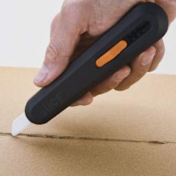 Slice Manual Utility Knife - Hand using Knife to open a package