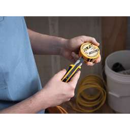 Olfa Pocket-Size Blade Disposal Can, blade being snapped into can
