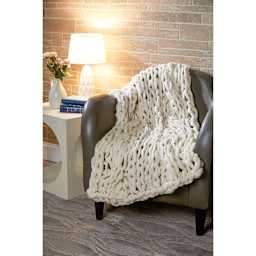 Premier Yarn Couture Jazz Yarn - Photo of Knit Afghan on chair in living room setting