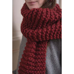 An Italian Story Ora Yarn - Closeup of person wearing Wine color knit scarf