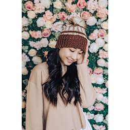 Lion Brand Basic Stitch Anti-Pilling Skein Tones Yarn (Person wearing multicolored knit hat)
