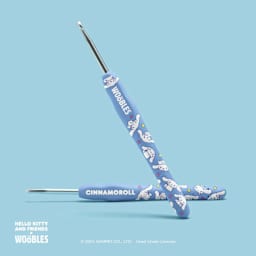 The Woobles Beginner Crochet Amigurumi Kit - Cinnamoroll from Hello Kitty - front and back of crochet needle