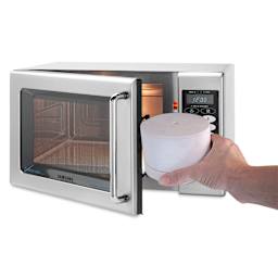 Fuseworks Microwave Glass Kiln being placed in microwave