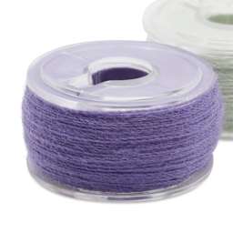 Dritz Class 15 Pre-Wound Reusable Bobbins - Set of 12, 50 yds close up of single bobbin