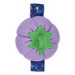 Dritz Tomato Wrist Pin Cushion - Violet out of packaging close-up