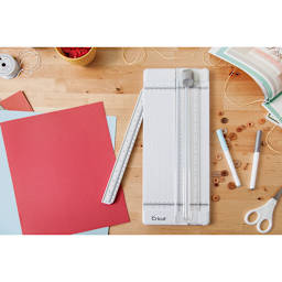 Cricut 12"” Essential Tool Set - Top view of Trimmer on table with swing out arm slightly extended