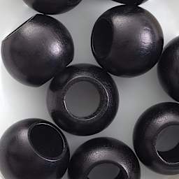 John Bead Euro Wood Beads - Black, Round Large Hole, 20 mm x 16 mm, Pkg of 9 - close-up of beads