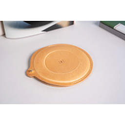 Makers Cabinet Leather Iris Sheath - 5" Diameter, resting on tabletop