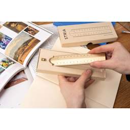 Makers Cabinet Stria Folding Ruler - 30 cm, held in hands