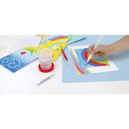 Faber-Castell Young Artist Learn to Watercolor Set -
Child's hand painting with water brush
