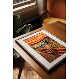 DMC The Masters Collection Cross Stitch Kit - “The Scream” by Edvard Munch frames sitting on table