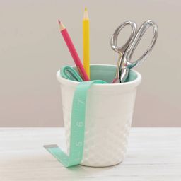 Dritz Ceramic Thimble Container - Aqua - in use on desk (items not included)