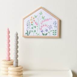 Rico Design Counted Cross Stitch House Kit - Flower Meadow House completed project mounted to wall