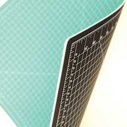Art Alternatives Self-Healing Cutting Mat - Green and Black, 36" x 48" rolled to show both sides