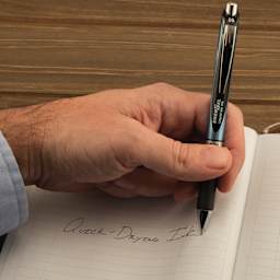 Pentel EnerGel RTX Gel Pen - Black, 0.5 mm, held in left hand