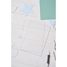 Sizzix Cutting Pads - Accessory A5, 6-1/8" x 10-1/4" x 1/8" stacked on table (only single cutting board included)