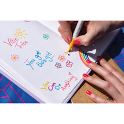 Colorista Glitter Markers - Sparkling Brights, single marker in hand writing a message on paper