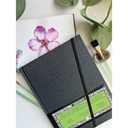 Arches Hardbound Watercolor Art Journal - 8.3" x 11", Cold Press, on talbetop with flower artwork